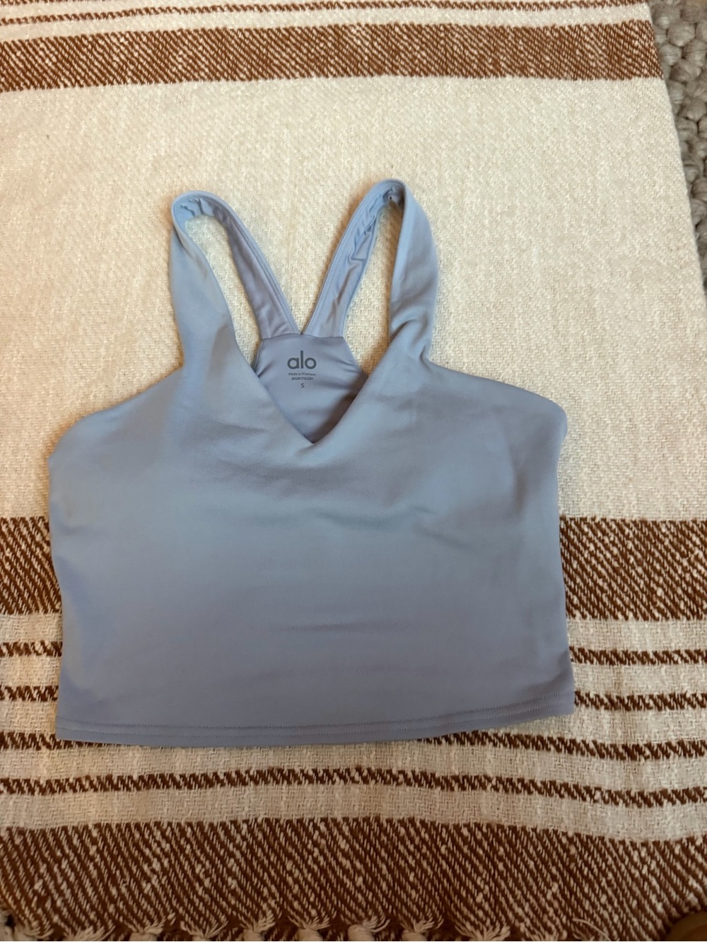 ALO Yoga Bra in the soft blue Winter Frost color